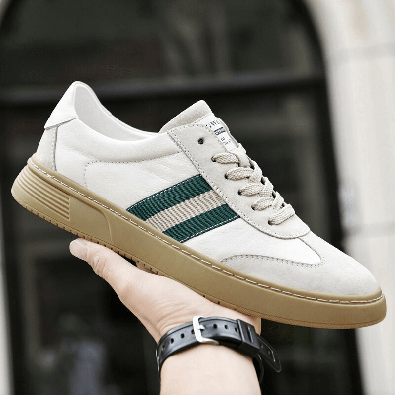 Stylish leather men's sports shoe with green stripe, breathable lining, and durable rubber sole, perfect for modern wardrobe.